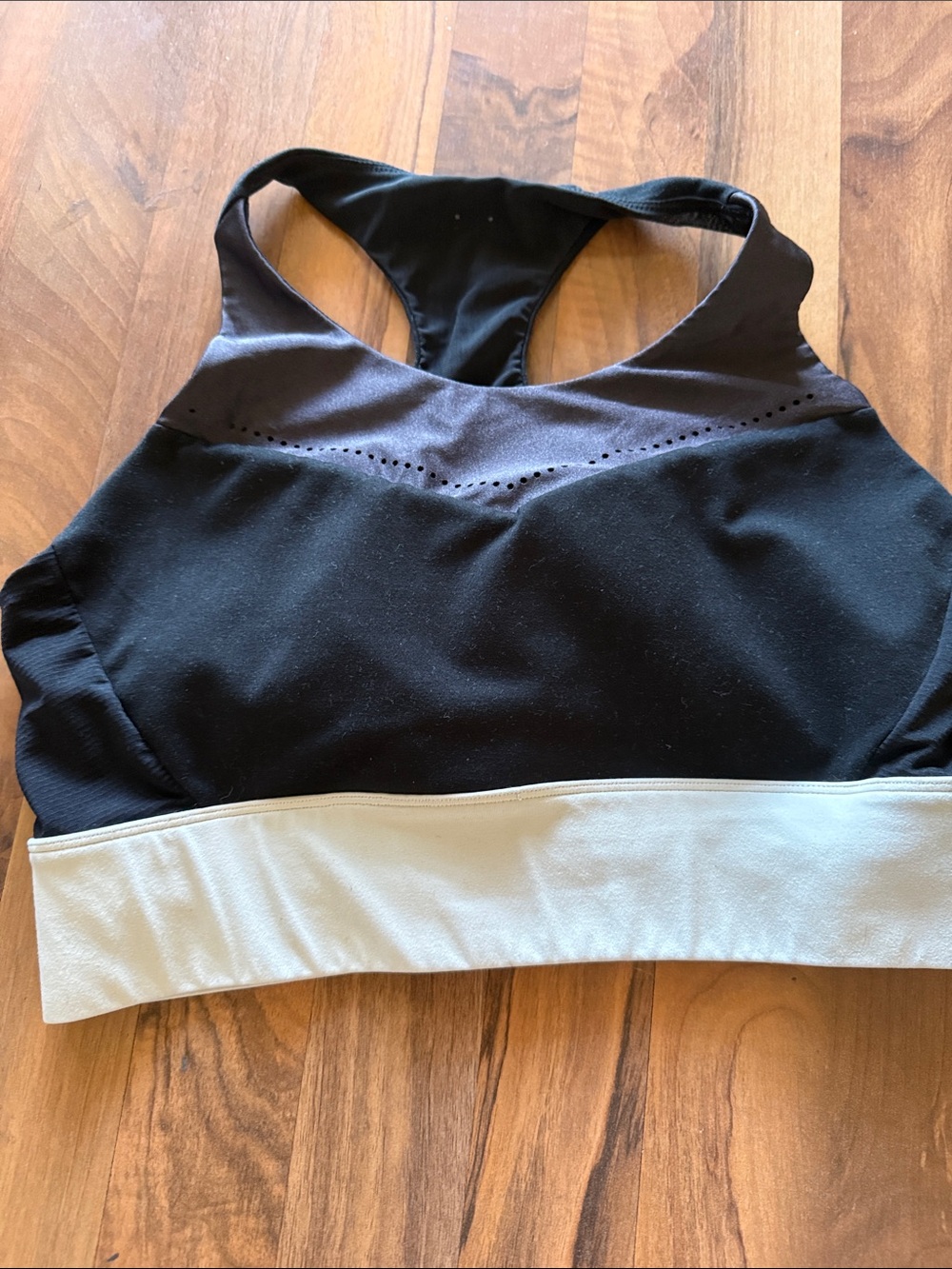 Fabletics Two-Tone Racerback Sports Bra in Black and Cream